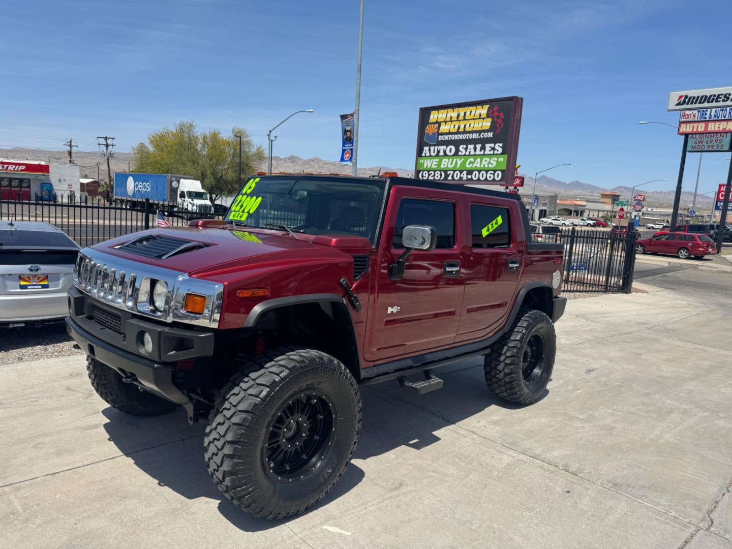 2005 Red /black Hummer H2 SUT , located at 2190 Hwy 95, Bullhead City, AZ, 86442, (928) 704-0060, 0.000000, 0.000000 - 2005 Hummer H2 SUT. only 92k miles. 6.0 V8 4 wheel drive. New transmission with warranty. New shocks. lots of extras .onstar. backup camera, custom stereo. fabtech 6 in lift with 40 in tires. Big Bad Hummer. $22900. Free and clear title. - Photo#1